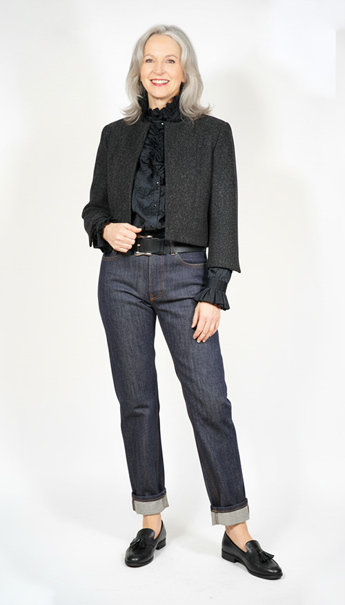 Model wearing Sewing Pattern Boxy Chanel Cut Jacket front view, made up in black Harris Tweed